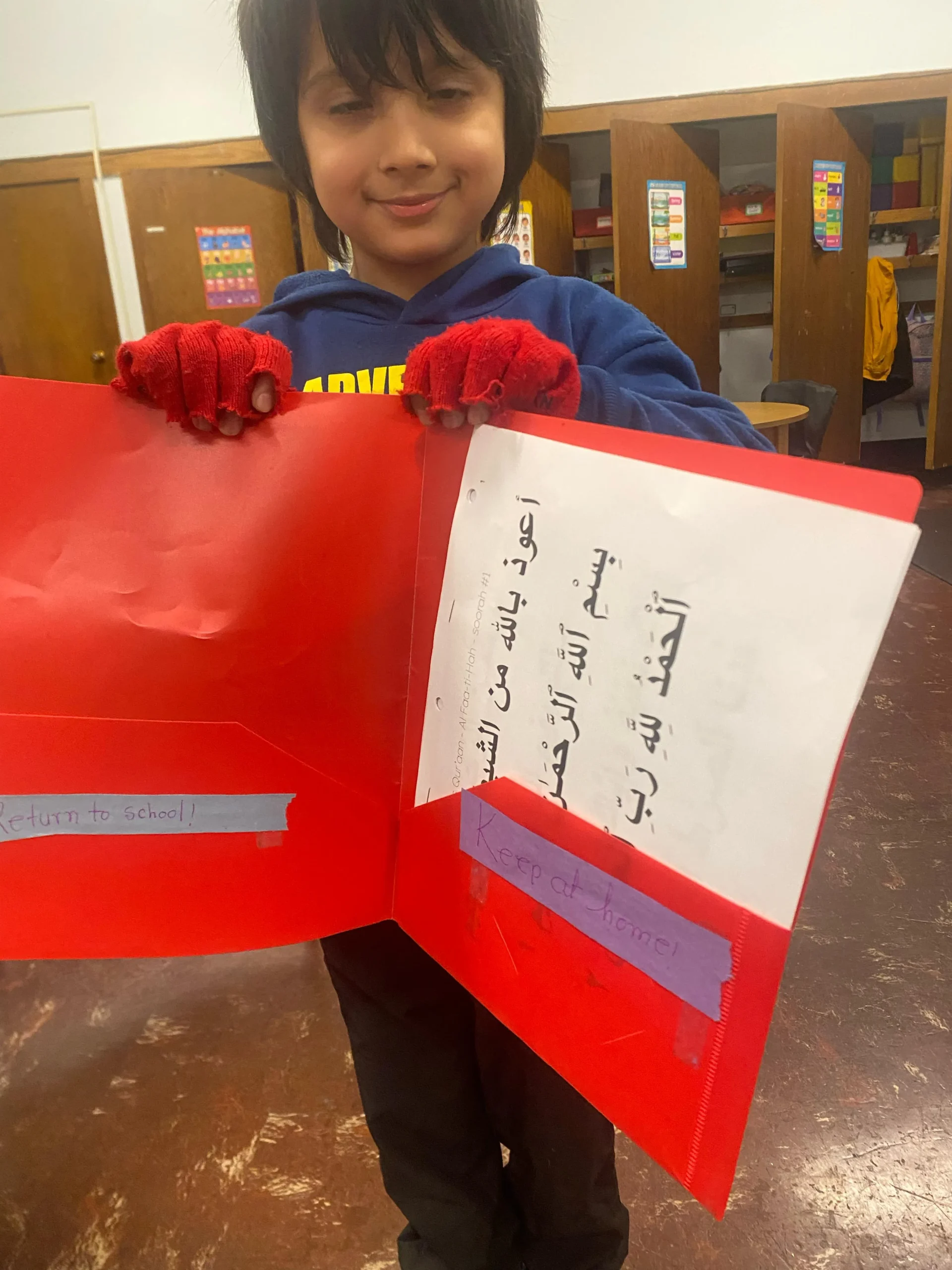 Students with Quran and Arabic work