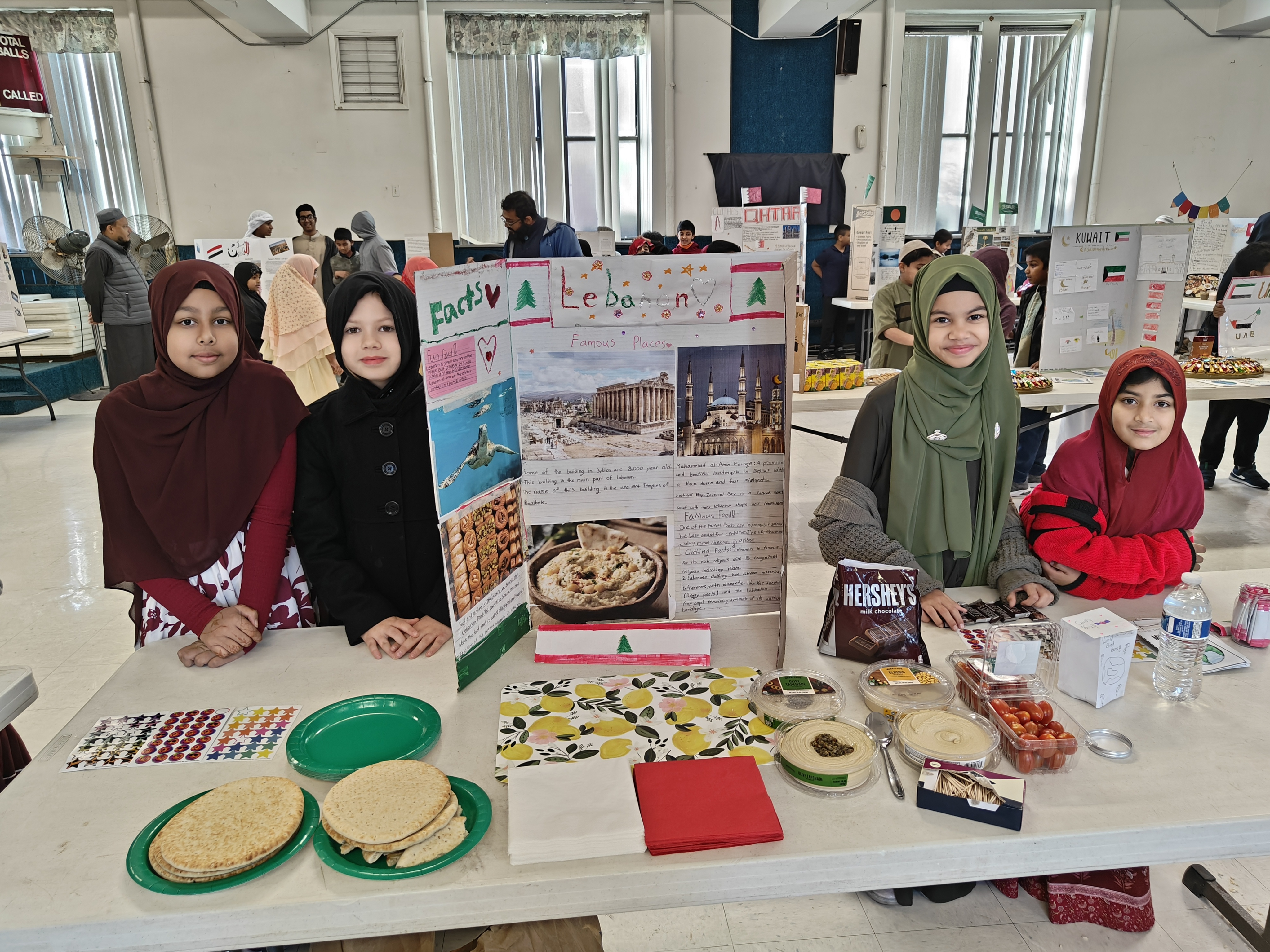 Students presenting country booths at culture fair