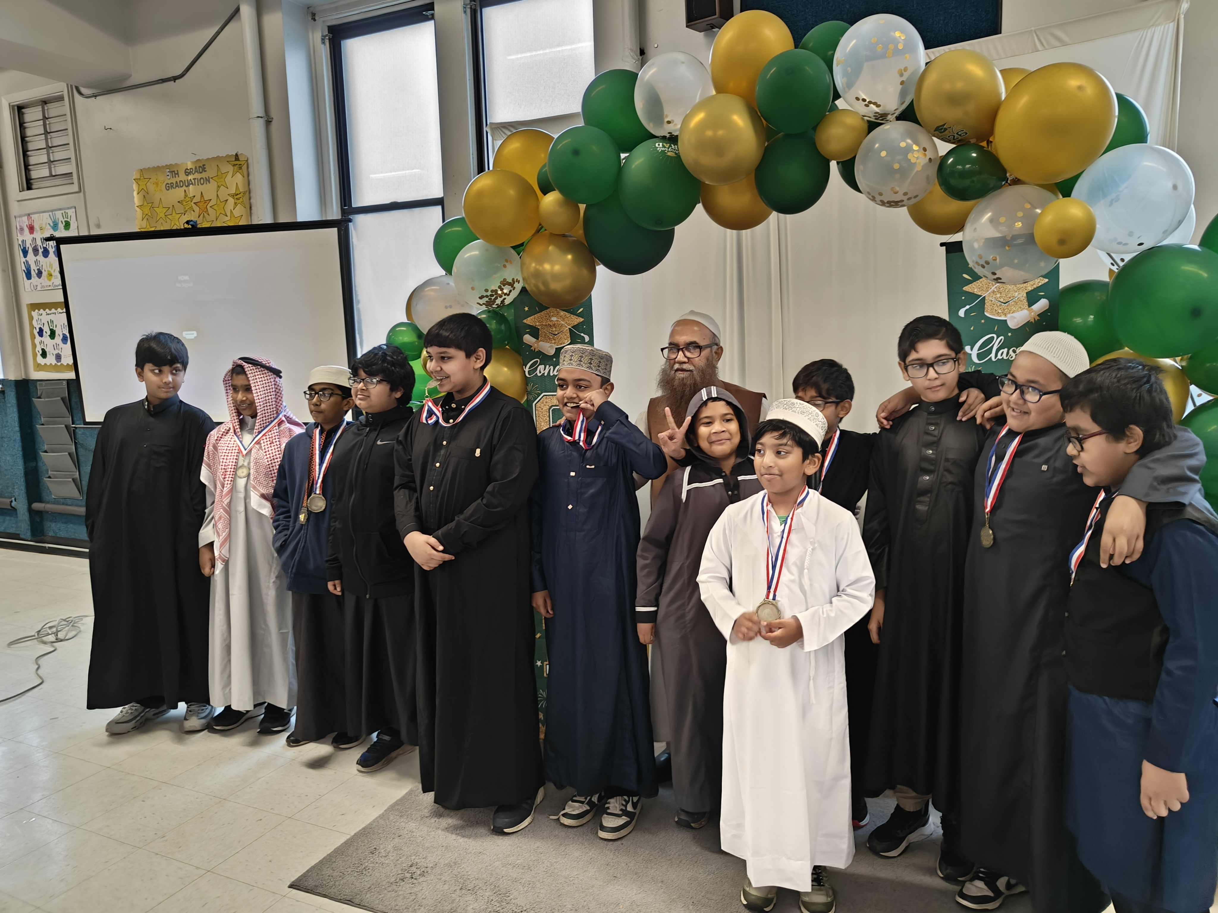 Boys wearing medals after Quran competition